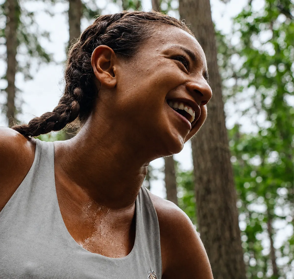 Runner smiling after a workout in the woods